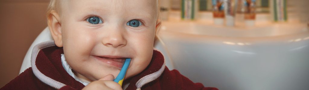 kid with a toothbrush 1920-1, child's oral healthcare